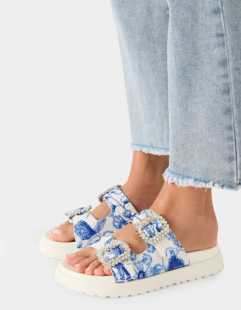 White sandal with blue bejeweled floral pattern and embellishments pair