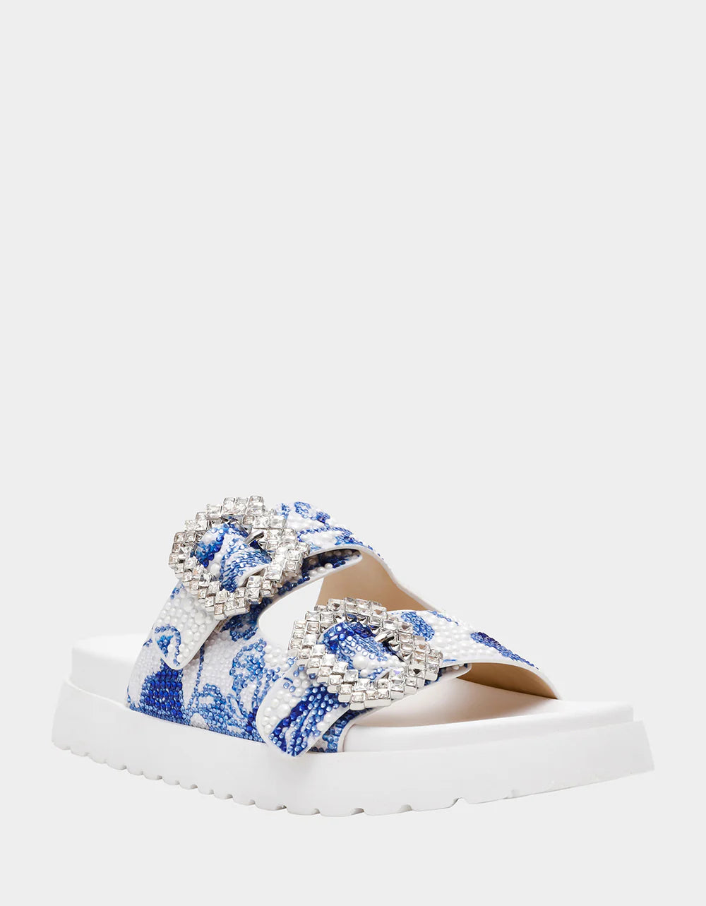 White sandal with blue bejeweled floral pattern and embellishments front view