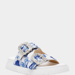 White sandal with blue bejeweled floral pattern and embellishments front view