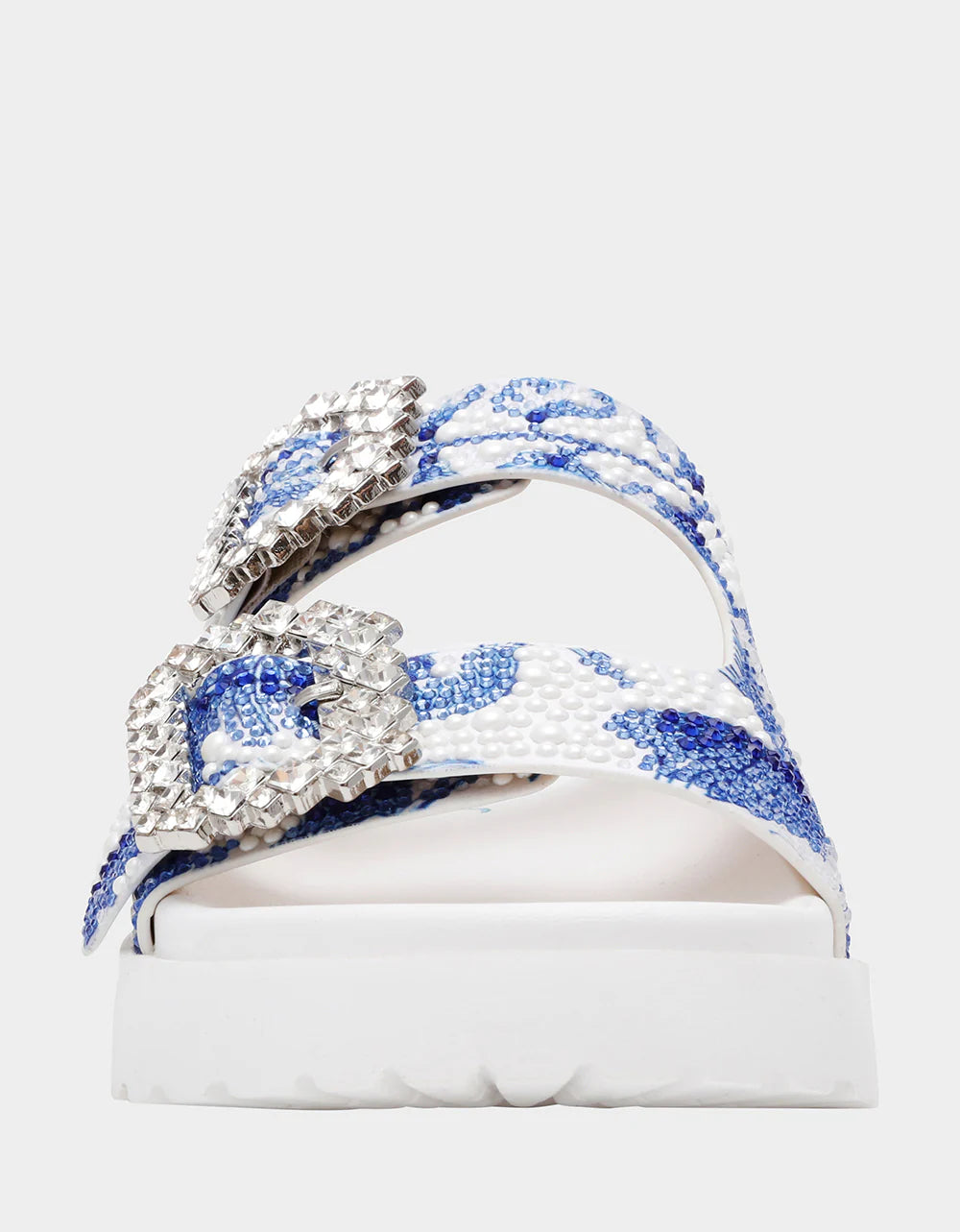 White sandal with blue bejeweled floral pattern and embellishments toe box