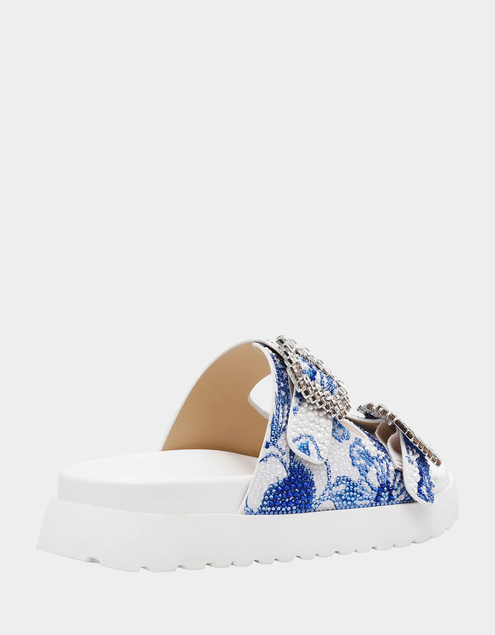 White sandal with blue bejeweled floral pattern and embellishments side view