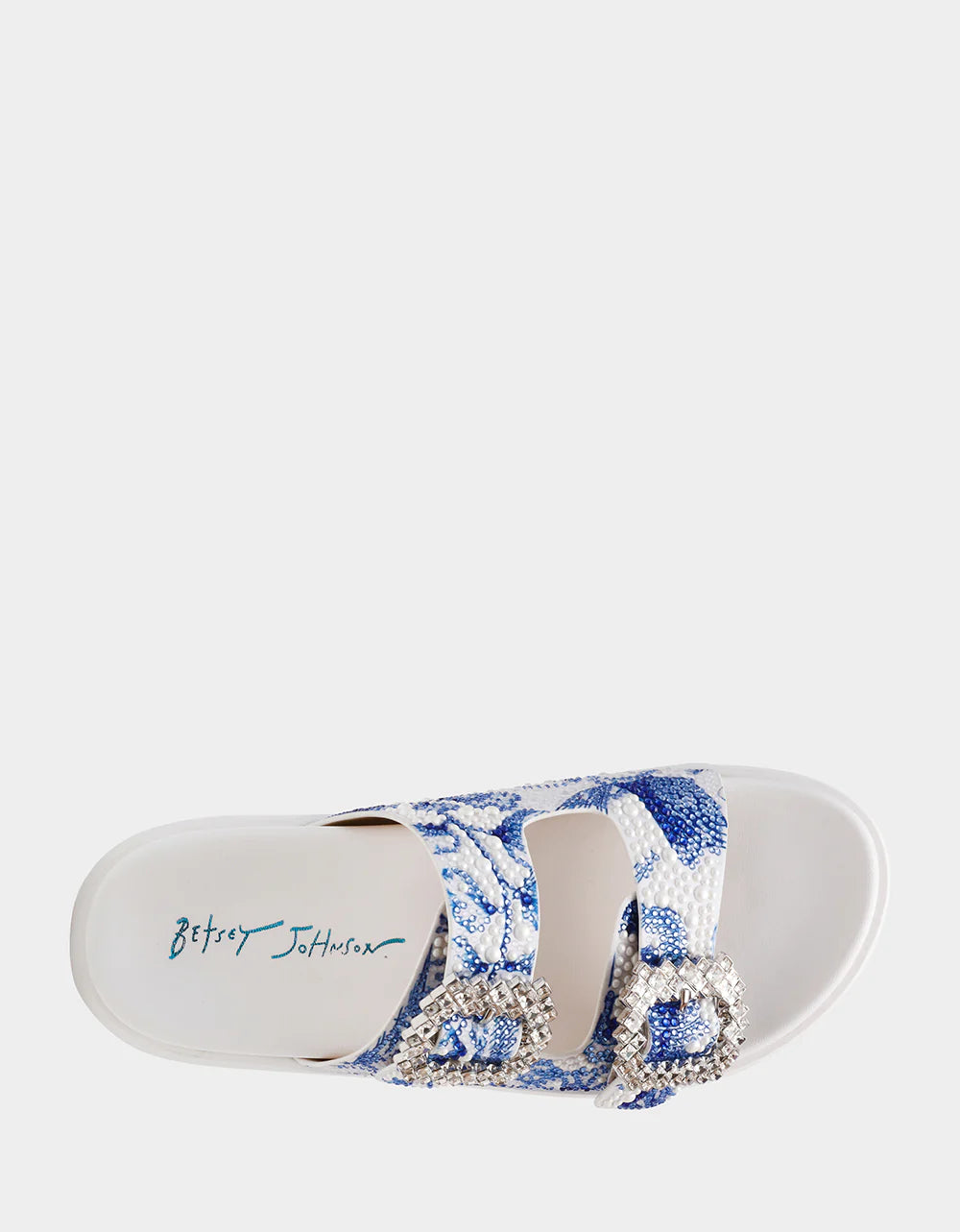 White sandal with blue bejeweled floral pattern and embellishments top view