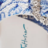 White sandal with blue bejeweled floral pattern and embellishments detail
