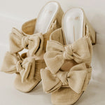 Rustic beige heel with a bow front view