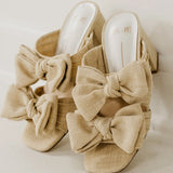 Rustic beige heel with a bow front view