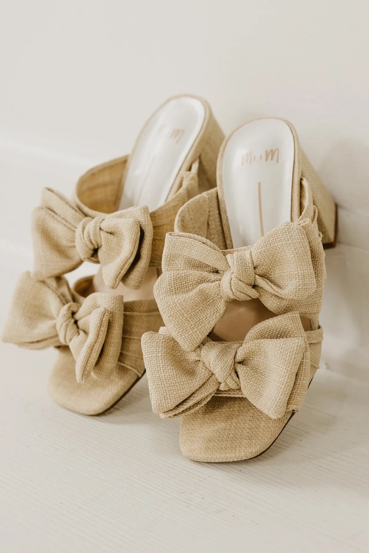 Rustic beige heel with a bow front view