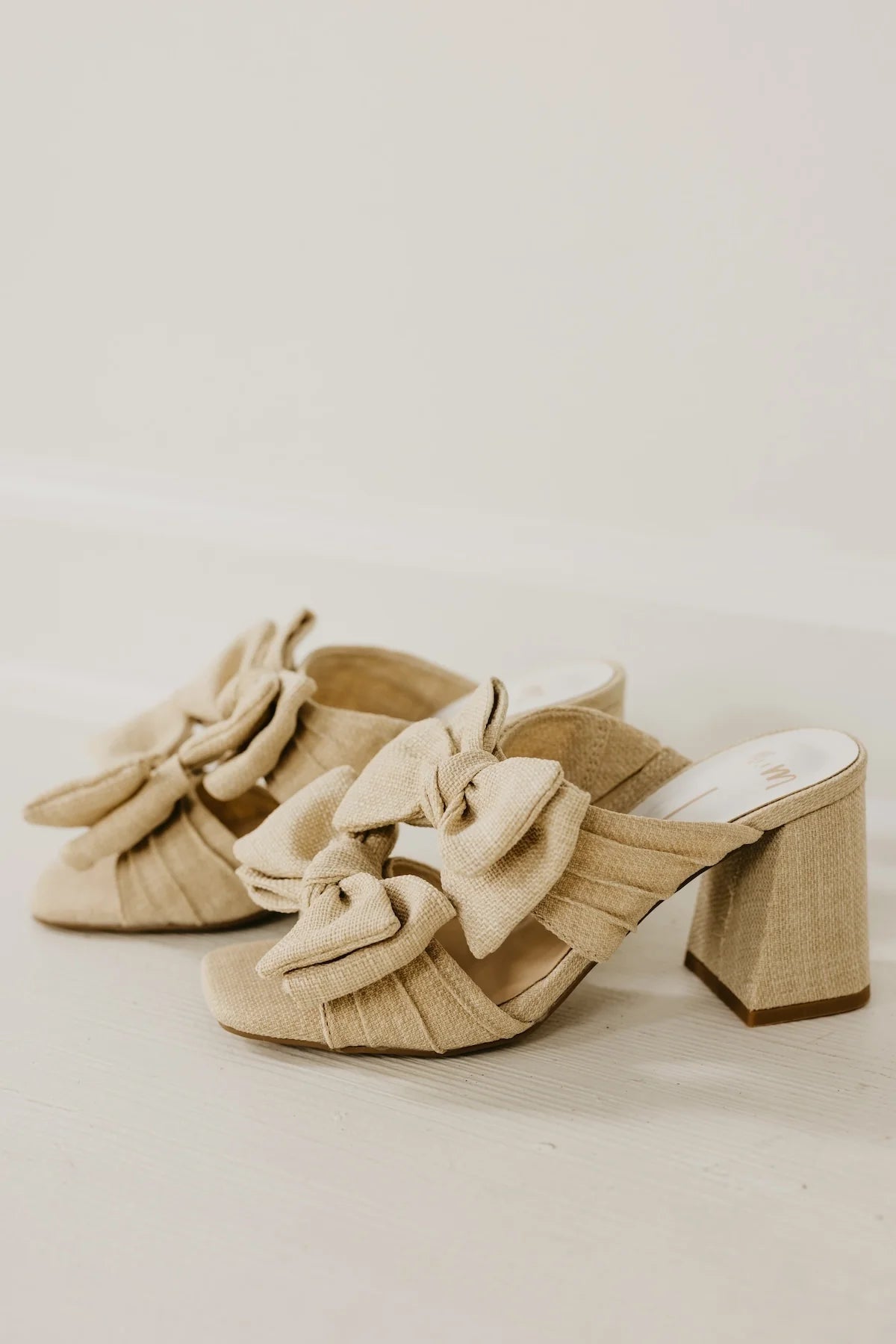 Rustic beige heel with a bow side view