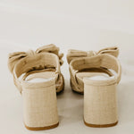 Rustic beige heel with a bow heel view