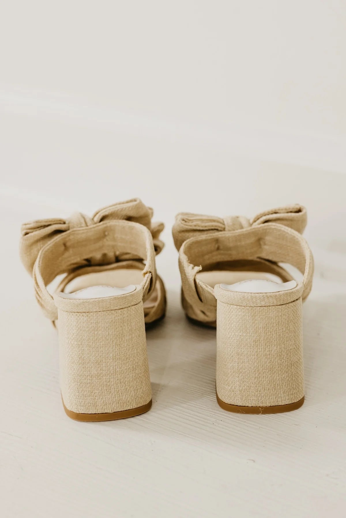 Rustic beige heel with a bow heel view