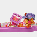 Colorful pink sandal with floral design and embellishments close-up