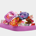 Colorful pink sandal with floral design and embellishments front view