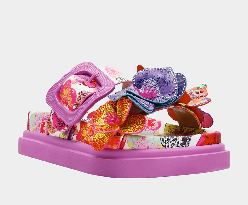 Colorful pink sandal with floral design and embellishments front view