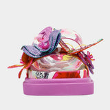 Colorful pink sandal with floral design and embellishments toe box