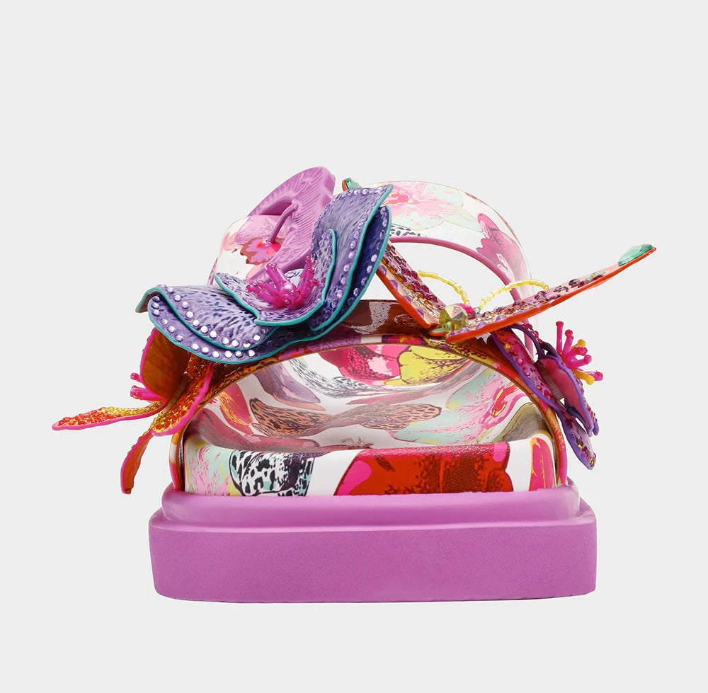 Colorful pink sandal with floral design and embellishments toe box