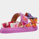Colorful pink sandal with floral design and embellishments side view