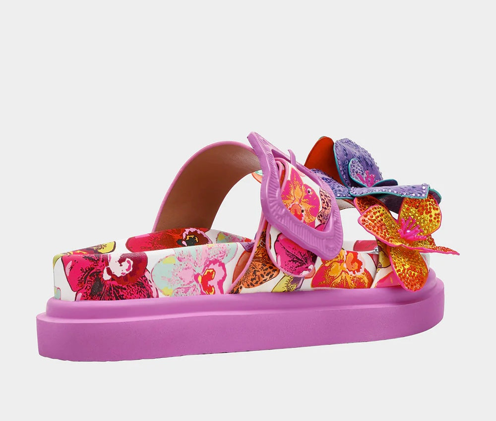 Colorful pink sandal with floral design and embellishments side view