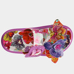 Colorful pink sandal with floral design and embellishments top view