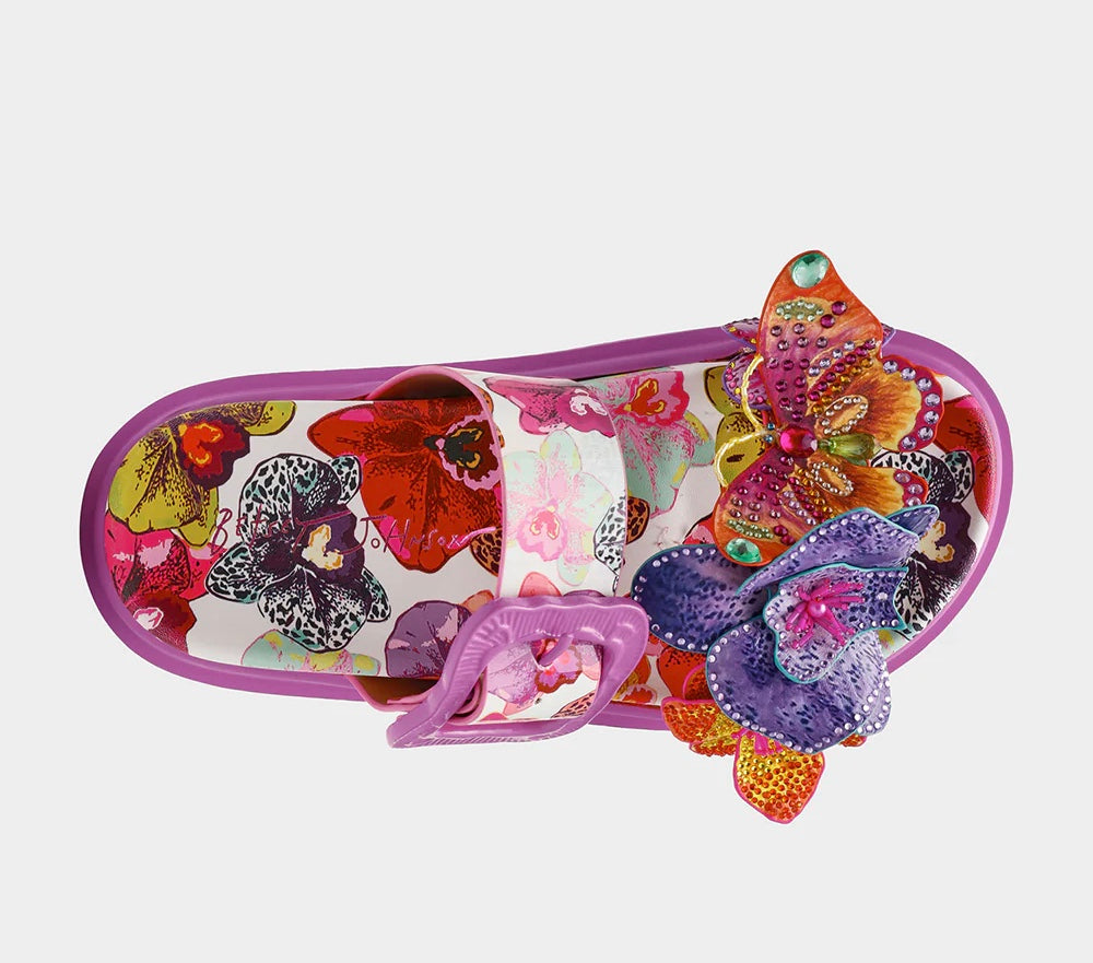 Colorful pink sandal with floral design and embellishments top view