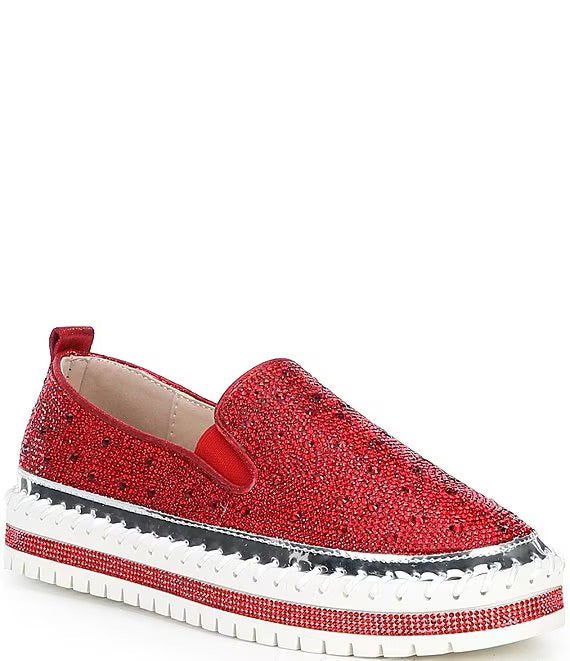 Red bejeweled slip-on shoe with a white sole close-up
