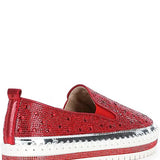 Red bejeweled slip-on shoe with a white sole heel view