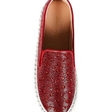 Red bejeweled slip-on shoe with a white sole top view