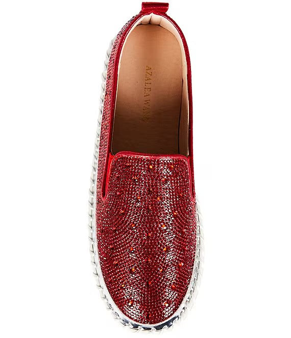 Red bejeweled slip-on shoe with a white sole top view