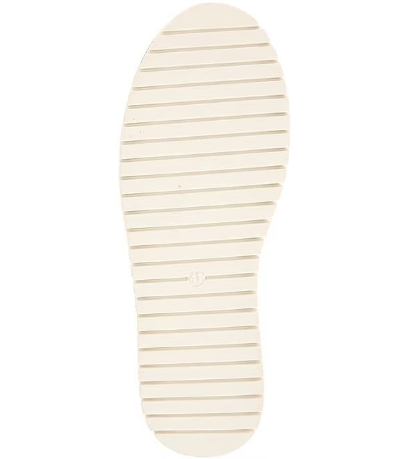 Red bejeweled slip-on shoe with a white sole sole