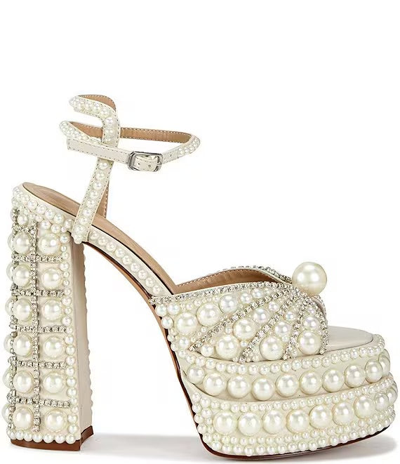 Elegant high-heeled shoe with pearl embellishments lose-up