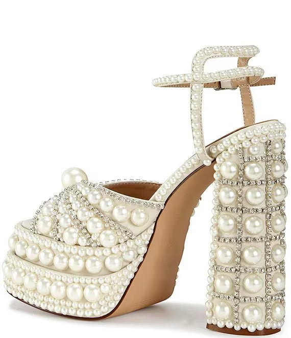 Elegant high-heeled shoe with pearl embellishments inner side view