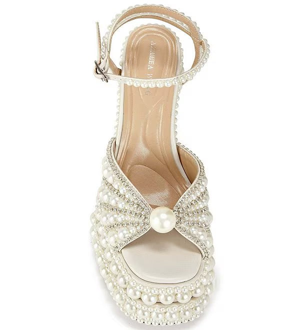 Elegant high-heeled shoe with pearl embellishments front view
