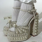 Elegant high-heeled shoe with pearl embellishments model
