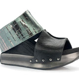 Black wedge sandals with alligator-like leather side view
