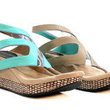 Wedge sandals with turquoise straps close-up