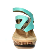 Wedge sandal with turquoise straps front view