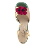 Open toe heeled shoe with gold strap, green sole, tan toe strap and raspberry flower top view