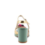 Open toe heeled shoe with gold strap, green sole, tan toe strap and raspberry flower heel view