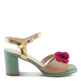 Open toe heeled shoe with gold strap, green sole, tan toe strap and raspberry flower close-up