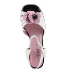 Open toe heeled shoe with white strap, black sole, and pink flower top view