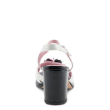 Open toe heeled shoe with white strap, black sole, and pink flower heel view