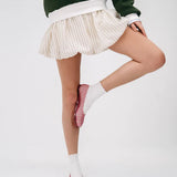 Pink woven jelly flat model pose
