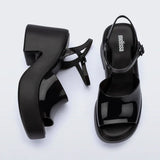Black platform heels with black strap & buckle closure top& side view