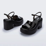 Black platform heels with black strap & buckle closure pair