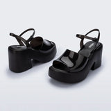 Black platform heels with black strap & buckle closure pair