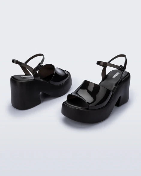Black platform heels with black strap & buckle closure pair