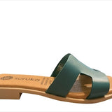 Green sandal with beige sole close-up