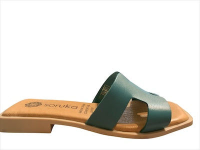 Green sandal with beige sole close-up