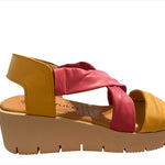 Yellow wedge with pink straps and beige heel close-up