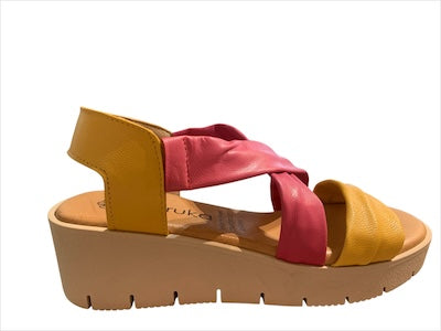 Yellow wedge with pink straps and beige heel close-up