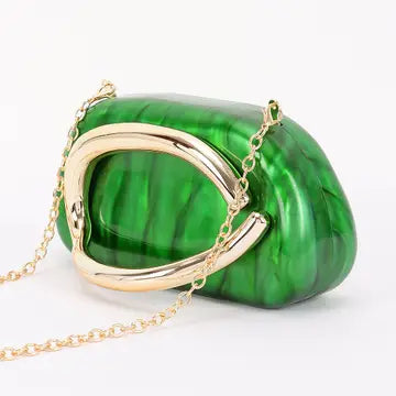 Green clutch bag with gold chain side view