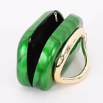 Green clutch bag with gold chain opening